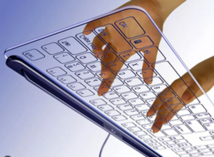 Sormet kirjoittaa läpinäkyvällä näppäimistöllä.